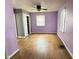 Bedroom with original hardwood floors, ceiling fan and natural light at 4853 Wentworth Blvd, Indianapolis, IN 46201