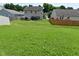 Expansive backyard featuring a deck and plenty of green space for outdoor activities and relaxation at 5151 Climbing Rose Pl, Indianapolis, IN 46254