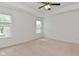 Spacious bedroom with fan, neutral carpet, and ample natural light at 5151 Climbing Rose Pl, Indianapolis, IN 46254