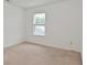 Bedroom with window and tan carpet at 5151 Climbing Rose Pl, Indianapolis, IN 46254