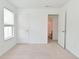 Bedroom with neutral carpet and door to ensuite bathroom at 5151 Climbing Rose Pl, Indianapolis, IN 46254