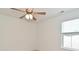 Bedroom with a ceiling fan and natural light from the window at 5151 Climbing Rose Pl, Indianapolis, IN 46254