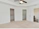 Bedroom with neutral carpet and doors to closets and ensuite bathroom at 5151 Climbing Rose Pl, Indianapolis, IN 46254