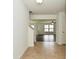 Foyer view leading to the living room, showcasing tile flooring and an open layout at 5151 Climbing Rose Pl, Indianapolis, IN 46254