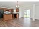 Bright kitchen with wooden cabinets, stainless steel appliances, and access to the backyard through sliding glass doors at 5151 Climbing Rose Pl, Indianapolis, IN 46254