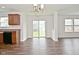 Well-lit kitchen featuring ample counter space, wooden cabinets and adjacent breakfast area with sliding door access at 5151 Climbing Rose Pl, Indianapolis, IN 46254