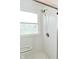 Shower features glass door and white tiled surround with rain shower head at 5151 Climbing Rose Pl, Indianapolis, IN 46254