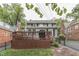 Spacious backyard featuring a deck, privacy fence, and lush greenery, perfect for outdoor enjoyment at 5306 N Kenwood Ave, Indianapolis, IN 46208