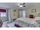 Comfortable bedroom with natural light, hardwood floors, and complemented by a bright interior at 5306 N Kenwood Ave, Indianapolis, IN 46208