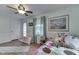 Bright bedroom with natural light, hardwood floors, and complimented by an exterior door at 5306 N Kenwood Ave, Indianapolis, IN 46208