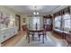Spacious dining room featuring a large window, hardwood floors, and traditional furniture at 5306 N Kenwood Ave, Indianapolis, IN 46208