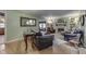 Elegant living room with hardwood floors, a fireplace, and comfortable seating arrangements at 5306 N Kenwood Ave, Indianapolis, IN 46208