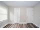 This bedroom boasts modern flooring, neutral walls and trim, and lots of natural light at 564 S Bosart Ave, Indianapolis, IN 46203