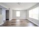 Bright bedroom with new flooring, natural light, closet, and neutral paint at 564 S Bosart Ave, Indianapolis, IN 46203
