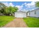 The one-car garage provides convenience and extra storage, complemented by a driveway at 564 S Bosart Ave, Indianapolis, IN 46203