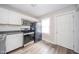 Modern kitchen features white cabinets, stainless steel appliances, and durable countertops at 564 S Bosart Ave, Indianapolis, IN 46203
