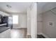 Kitchen area that features a laundry room area with wire shelving at 564 S Bosart Ave, Indianapolis, IN 46203