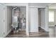 Utility closet with shelving, sliding door, HVAC unit, and water heater at 564 S Bosart Ave, Indianapolis, IN 46203
