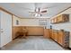 This finished basement includes cabinetry, and an adjacent room with an exercise machine at 580 Northgate Dr, Greenwood, IN 46143