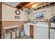 Basement laundry room featuring washer, dryer, and folding space with storage at 580 Northgate Dr, Greenwood, IN 46143