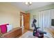 Home office features a bench, a desk with dual monitors, and hardwood floors at 580 Northgate Dr, Greenwood, IN 46143