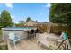 Above ground pool, bar area, lounge chairs, and deck at 580 Northgate Dr, Greenwood, IN 46143