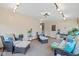 Inviting sunroom with comfortable seating, track lighting, and a view of the backyard at 580 Northgate Dr, Greenwood, IN 46143