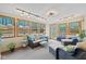 Relaxing sunroom with wicker furniture, bright windows, and plenty of natural light at 580 Northgate Dr, Greenwood, IN 46143