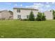 Expansive backyard with a well-maintained lawn and a charming deck area for outdoor enjoyment at 5852 Long Ridge Pl, Indianapolis, IN 46221