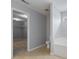 Bathroom featuring a toilet and separate soaking tub, also showcasing a walk-in closet at 5852 Long Ridge Pl, Indianapolis, IN 46221