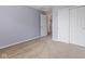 Bedroom with closet and door to hallway, carpet, and neutral walls, creating a comfortable space at 5852 Long Ridge Pl, Indianapolis, IN 46221