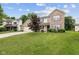 Charming two-story brick home featuring an attached two car garage and a well manicured front yard at 5852 Long Ridge Pl, Indianapolis, IN 46221