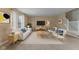 Nicely staged living room with neutral paint, and decorative furniture at 5852 Long Ridge Pl, Indianapolis, IN 46221