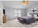 The stylish main bedroom features modern decor, a comfortable bed, and soft natural lighting at 5852 Long Ridge Pl, Indianapolis, IN 46221