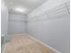 Spacious walk-in closet with ample shelving for storage and organization at 5852 Long Ridge Pl, Indianapolis, IN 46221