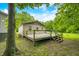 Spacious back deck is perfect for entertaining, with views of a wooded lot, blue skies and plenty of room at 5858 N West Shore Dr, Morgantown, IN 46160