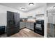 Well-lit kitchen boasts stainless appliances, butcher block counters, updated cabinets and flooring at 5858 N West Shore Dr, Morgantown, IN 46160