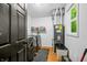 Clean laundry room featuring modern appliances and neutral paint, as well as a water heater at 5858 N West Shore Dr, Morgantown, IN 46160