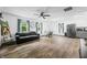 Large, bright living room features cohesive design with laminate flooring, eat-in dining area, and modern decor at 5858 N West Shore Dr, Morgantown, IN 46160