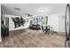 Spacious, open living room features vinyl plank flooring, eat-in dining area, and comfortable seating at 5858 N West Shore Dr, Morgantown, IN 46160