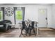 Open-concept living area boasts dining table, modern flooring, and abundant natural light at 5858 N West Shore Dr, Morgantown, IN 46160