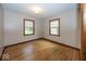 Bright bedroom with hardwood floors and plenty of natural light at 6005 Winthrop Ave, Indianapolis, IN 46220
