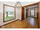 Inviting dining room boasting hardwood floors and natural light from large windows at 6005 Winthrop Ave, Indianapolis, IN 46220