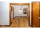 Open dining room featuring a modern chandelier and beautiful hardwood floors at 6005 Winthrop Ave, Indianapolis, IN 46220