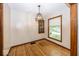 Bright dining area with hardwood floors, a modern light fixture and natural light at 6005 Winthrop Ave, Indianapolis, IN 46220