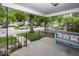 Inviting covered front porch with seating, decorative iron railings, and a view of the neighborhood at 6005 Winthrop Ave, Indianapolis, IN 46220