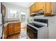 Well-lit kitchen with updated appliances and a view of the backyard at 6005 Winthrop Ave, Indianapolis, IN 46220