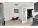 Bright kitchen area with tiled floors, doorway to sitting area, and essential appliances for modern living at 602 Pioneer Dr, Indianapolis, IN 46217