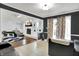Open-concept living room featuring tiled floors, vaulted ceiling, and a cozy fireplace in a stylish layout at 602 Pioneer Dr, Indianapolis, IN 46217