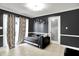 Comfortable sitting room with dark walls, tiled floors, and a lounge sofa, perfect for relaxing at 602 Pioneer Dr, Indianapolis, IN 46217